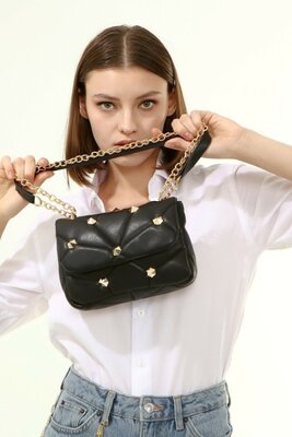 Чорна жіноча сумка зі стильною геометричною фурнітурою. фірмова Туреччина